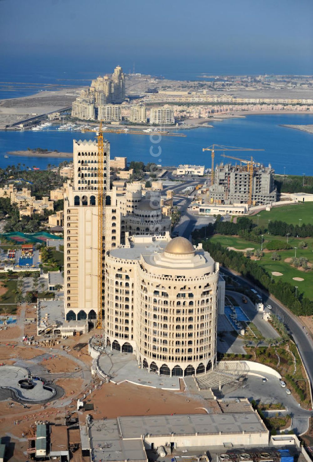 Ras Al Khaimah from above - Construction site of the Al Hamra Palace Hotel in the arab emirate Ras Al Khaimah. The hotel is part of the Al Hamra Village Project, the second largest construction project of Ras Al Khaimah. The project is realized by the state-owned company Al Hamra Real Estate