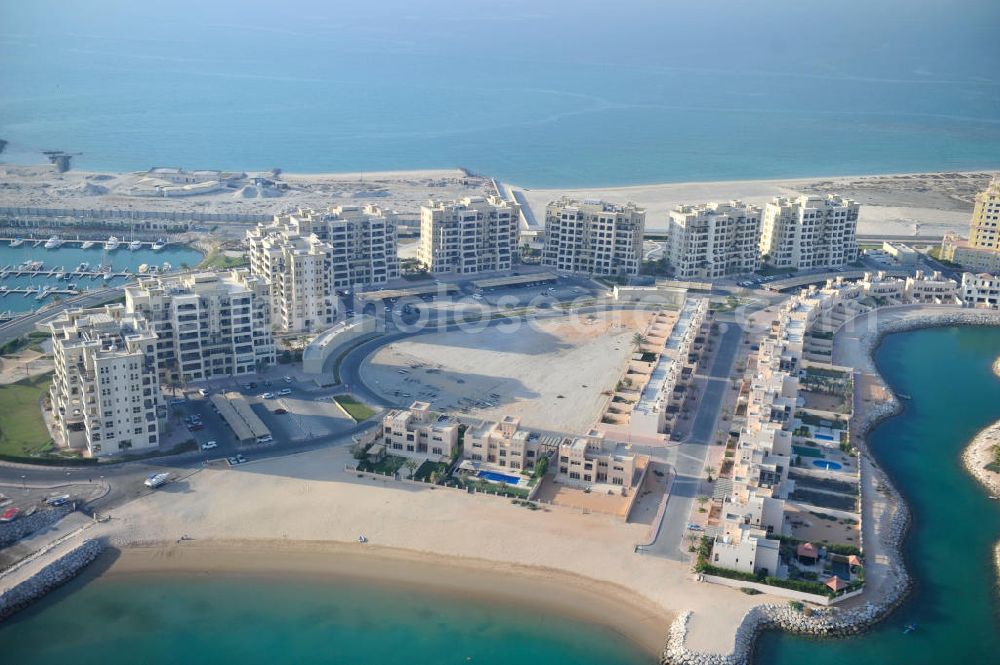 Aerial image Ras Al Khaimah - Construction site of the Al Hamra Village Project in the arab emirate Ras Al Khaimah. The project is realized by the state-owned company Al Hamra Real Estate