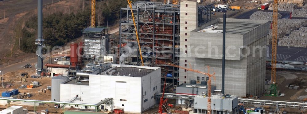 Aerial photograph Eisenhüttenstadt - Construction site at the heating plant on the factory site for corrugated base paper Propapier PM2 GmbH plant in Eisenhuettenstadt in Brandenburg. The heating plant supplies only the paper factory with electricity, steam and heat