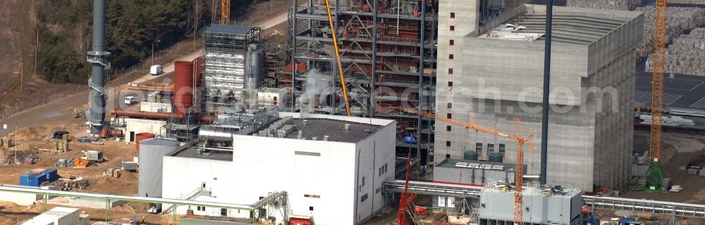 Eisenhüttenstadt from above - Construction site at the heating plant on the factory site for corrugated base paper Propapier PM2 GmbH plant in Eisenhuettenstadt in Brandenburg. The heating plant supplies only the paper factory with electricity, steam and heat