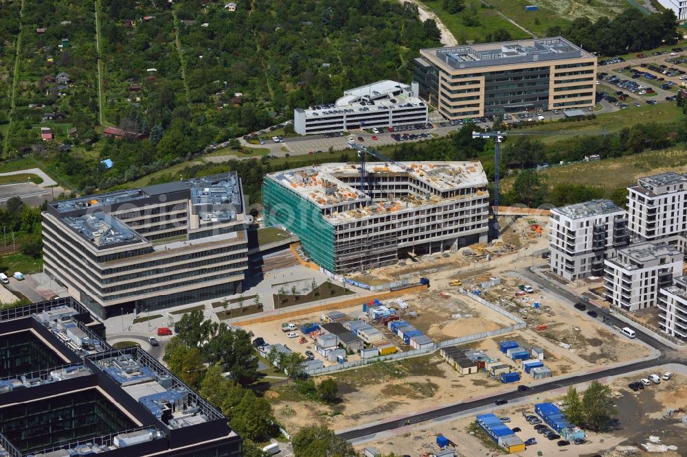 Warschau from above - Construction site behind the Konstruktorska Business Center in the Mokotow District in Warsaw in Poland. The area of the Konstruktorska Street in the West of the district has been developed as a business district with modern office buildings. The Konstruktorska Business Center and the adjacent buildings were built starting in 2012. The buildings in the background are a park deck and the seat of Carlsberg Poland