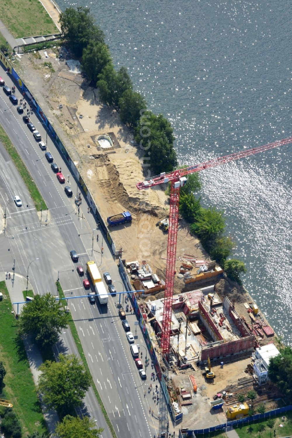 Aerial photograph Berlin - Construction site of Project Living Levels at Muhlenstrasse on the banks of the River Spree in Berlin - Friedrichshain. On the grounds of the Berlin Wall border strip at the EastSideGallery, the company Living Bauhaus is building a futuristic high-rise residential. The real estate service company City & Home GmbH manages the available apartments