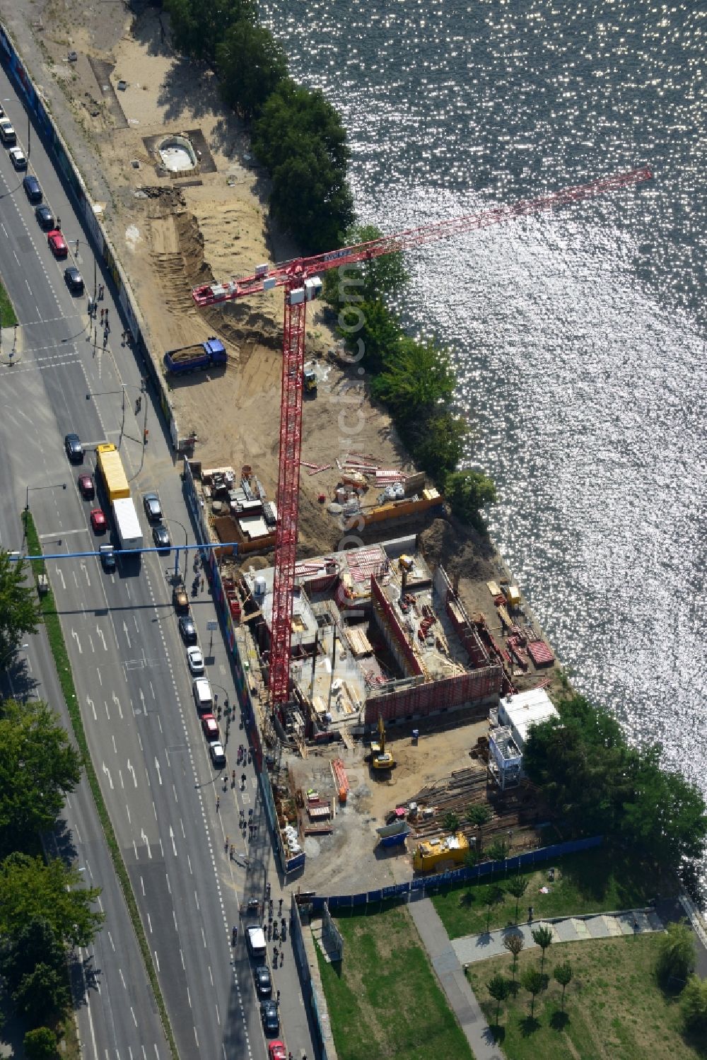 Berlin from above - Construction site of Project Living Levels at Muhlenstrasse on the banks of the River Spree in Berlin - Friedrichshain. On the grounds of the Berlin Wall border strip at the EastSideGallery, the company Living Bauhaus is building a futuristic high-rise residential. The real estate service company City & Home GmbH manages the available apartments