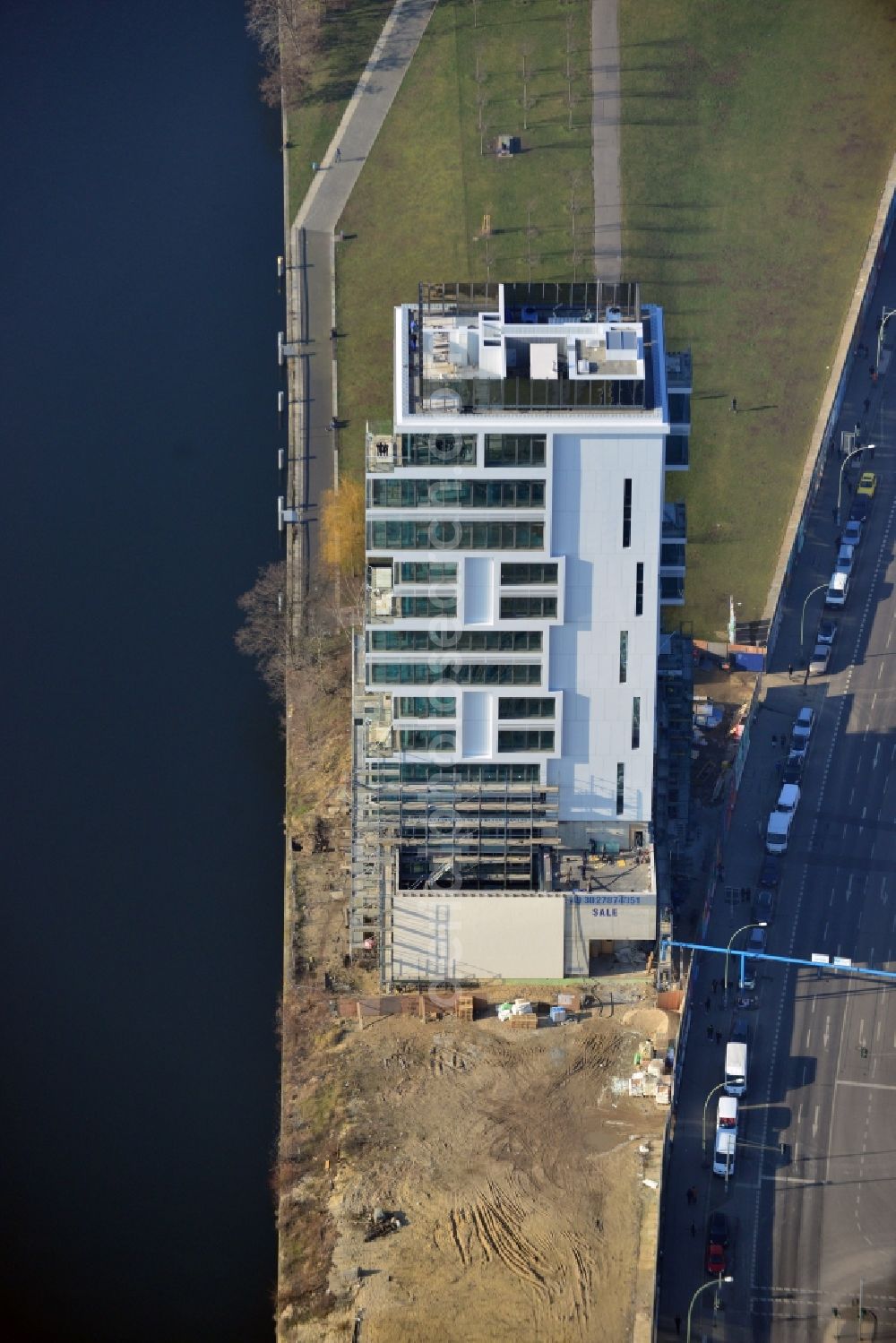 Berlin from above - Construction site of Project Living Levels at Muhlenstrasse on the banks of the River Spree in Berlin - Friedrichshain. On the grounds of the Berlin Wall border strip at the EastSideGallery, the company Living Bauhaus is building a futuristic high-rise residential. The real estate service company City & Home GmbH manages the available apartments