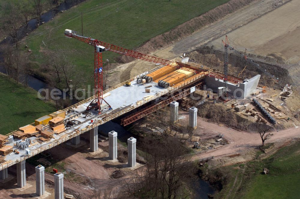 Aerial photograph Sättelstädt - Blick auf die Baustelle der neuen Hörseltalbrücke mit einer Länge von 195 m. Die Brücke ist Teil des Projekt Nordverlegung / Umfahrung Hörselberge der Autobahn E40 / A4 in Thüringen bei Eisenach. Durchgeführt werden die im Zuge dieses Projektes notwendigen Arbeiten unter an derem von den Mitarbeitern der Niederlassung Weimar der EUROVIA Verkehrsbau Union sowie der Niederlassungen Abbruch und Erdbau, Betonstraßenbau, Ingenieurbau und TECO Schallschutz der EUROVIA Beton sowie der DEGES.