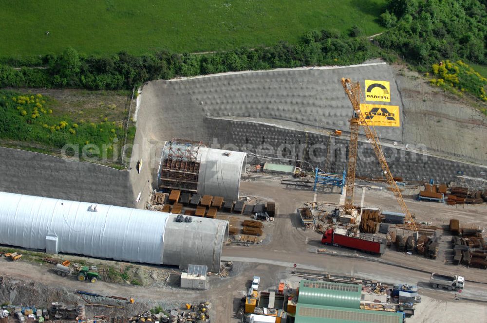 Göschwitz bei Jena from the bird's eye view: Blick auf die Baustelle der Autobahnverlegung Europastrasse E40 A4 bei Jena im Bereich des Jagdbergtunnels. Bauherr: DEGES (Deutsche Einheit Fernstraßenplanungs- und bau GmbH, Berlin), Bauausführung: ARGE: Baresel, Beton und Monierbau, Kirchhoff Leipzig Ausführungsplanung: Bauzeit: 2008 - 2012 View of the construction site chase mountain highway tunnel laying E40 European highway A4 at Jena.