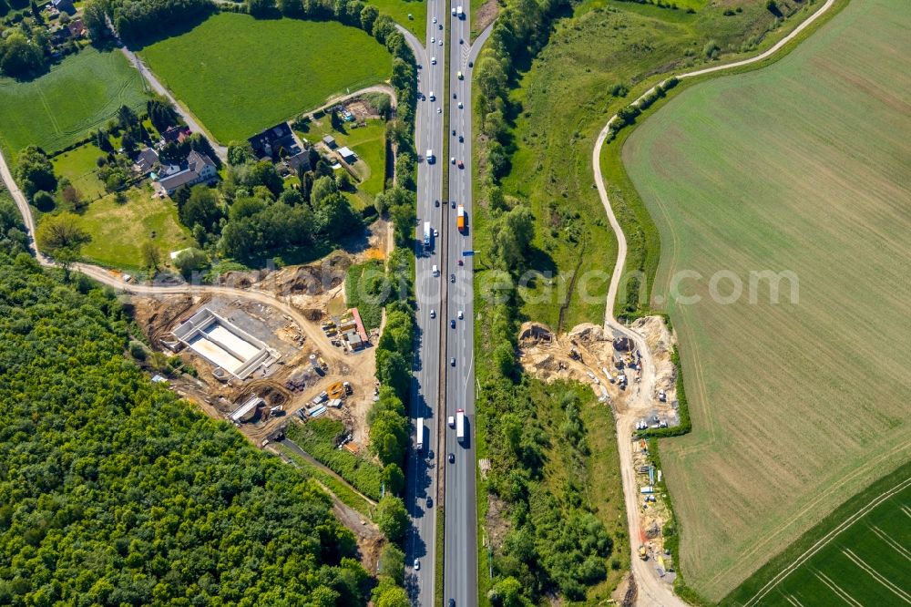 Aerial image Harpen - Construction site of the sewer works and construction of a rain overflow basin on the Harpener Bach Auf der Sporkel in Harpen in the state North Rhine-Westphalia, Germany