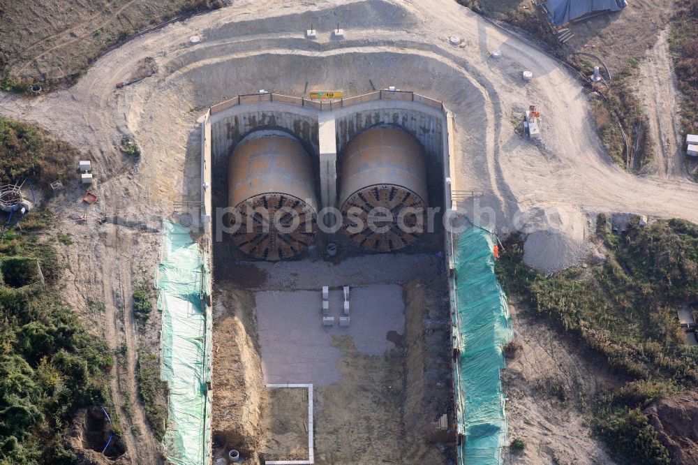 Aerial photograph Bad Bellingen - Construction site at the north portal of the Katzenberg tunnel in Bad Bellingen in the state of Baden-Wuerttemberg. The two drilling heads from Herrenknecht for the four-lane expansion of the Upper Rhine railway track have reached their final destination