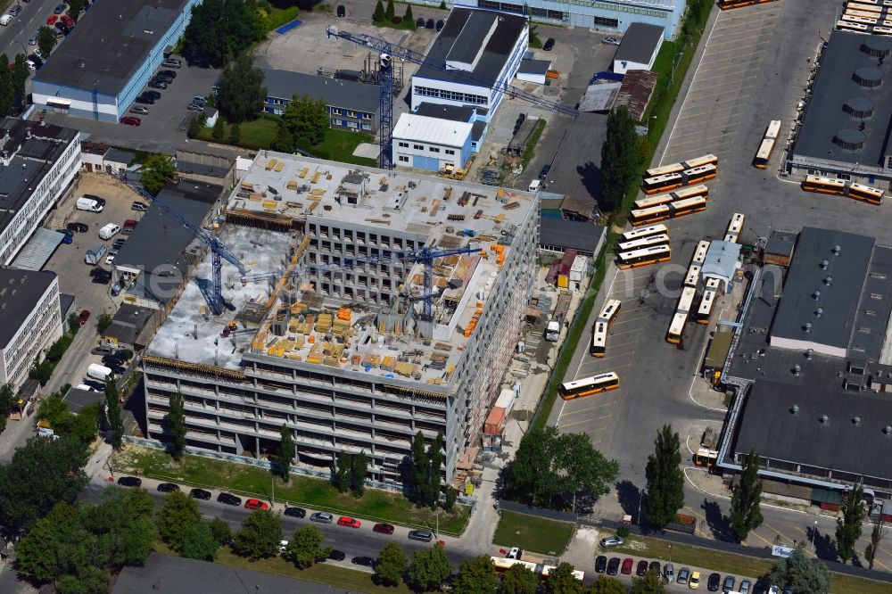 Warschau from above - Construction site on Konstruktorska Street in the Mokotow district in Warsaw in Poland. The new development is a project of WB Projekt. It is located adjacent to the bus depot of the district. The square building is currently in the phase of structural work