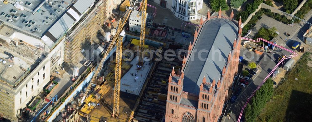 Aerial photograph Berlin - View of construction site of the Kronprinzengärten in Berlin-Mitte. On the area between the Federal Foreign Office, the Kronprinzenpalais, the Friedrichswerder Church and the Oberwallstreet created an exclusive building complex of luxury apartments. This new project is implemented by the Bauwert Investment Group
