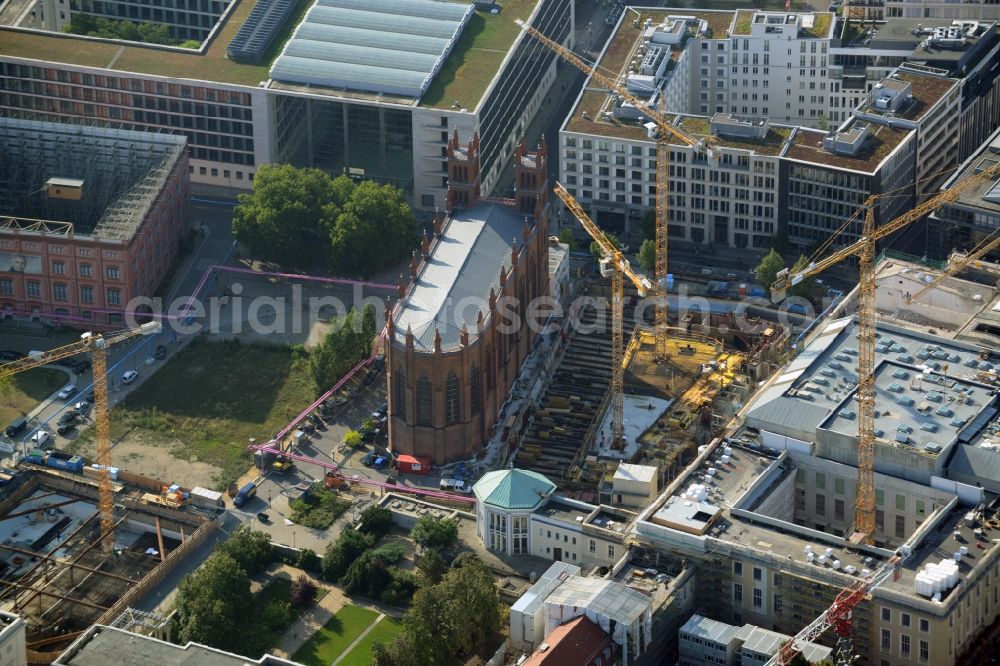 Berlin from the bird's eye view: View of construction site of the Kronprinzengärten in Berlin-Mitte. On the area between the Federal Foreign Office, the Kronprinzenpalais, the Friedrichswerder Church and the Oberwallstreet created an exclusive building complex of luxury apartments. This new project is implemented by the Bauwert Investment Group
