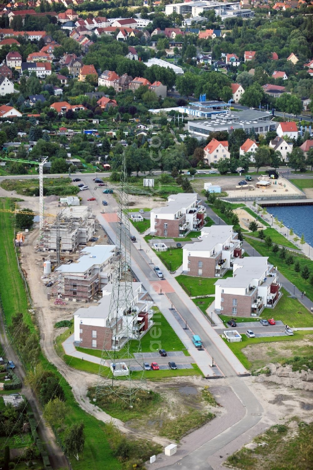 Aerial image Bitterfeld - Construction site of newly built flats at a lake in Bitterfeld in Saxony-Anhalt