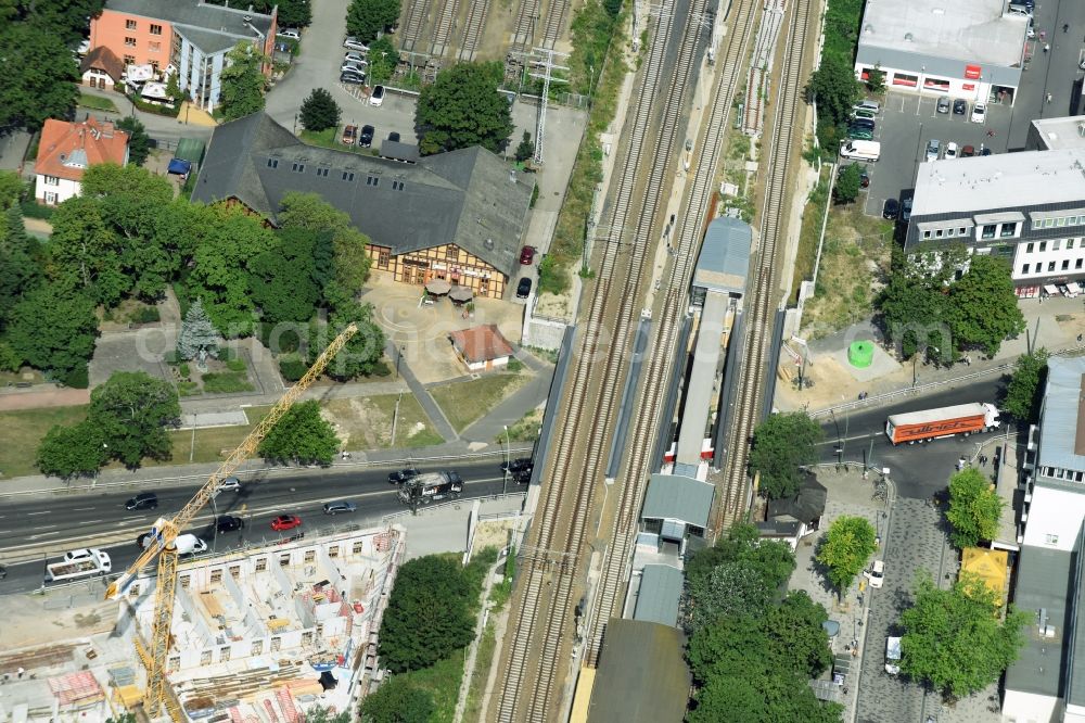 Aerial photograph Berlin - New construction comany Mark-A. Krueger Bauunternehmung GmbH of the building complex of the shopping center Treskowallee - Am Carlsgarten on city- train station Karlshorst in Berlin