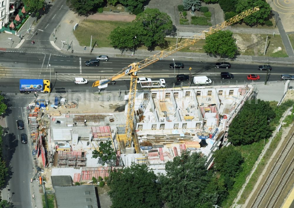 Aerial photograph Berlin - New construction comany Mark-A. Krueger Bauunternehmung GmbH of the building complex of the shopping center Treskowallee - Am Carlsgarten on city- train station Karlshorst in Berlin