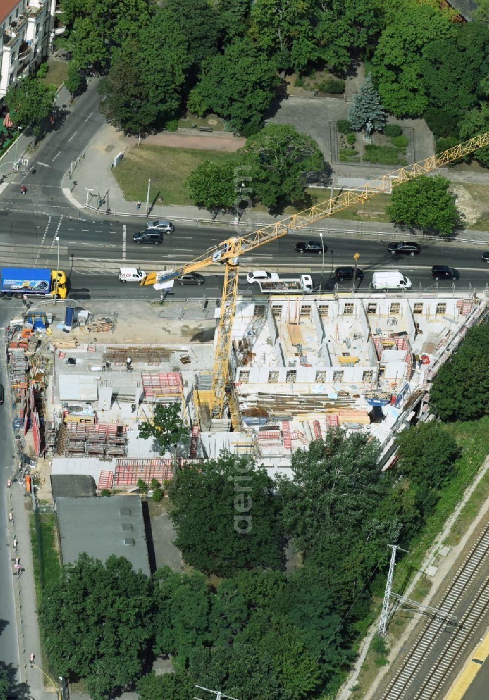 Berlin from above - New construction comany Mark-A. Krueger Bauunternehmung GmbH of the building complex of the shopping center Treskowallee - Am Carlsgarten on city- train station Karlshorst in Berlin