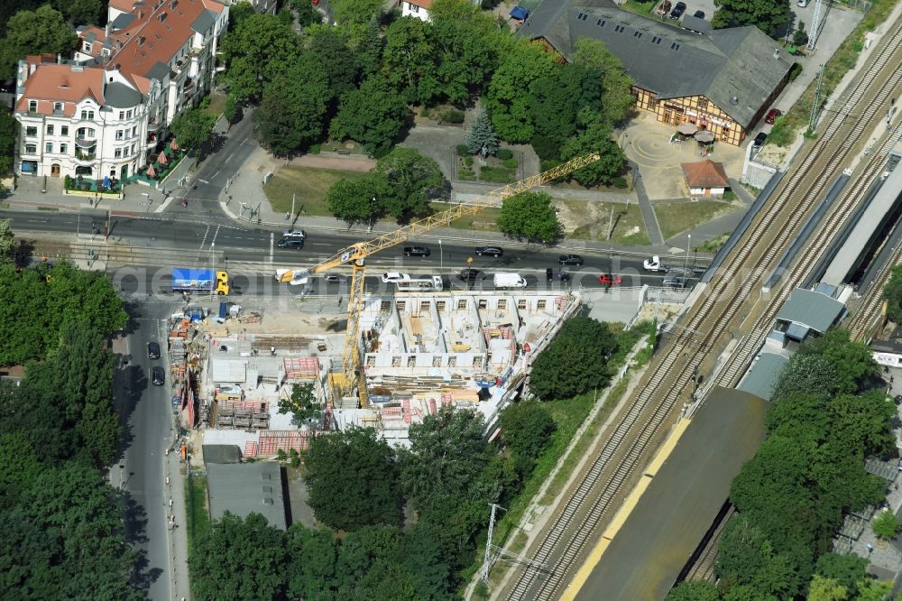 Berlin from the bird's eye view: New construction comany Mark-A. Krueger Bauunternehmung GmbH of the building complex of the shopping center Treskowallee - Am Carlsgarten on city- train station Karlshorst in Berlin