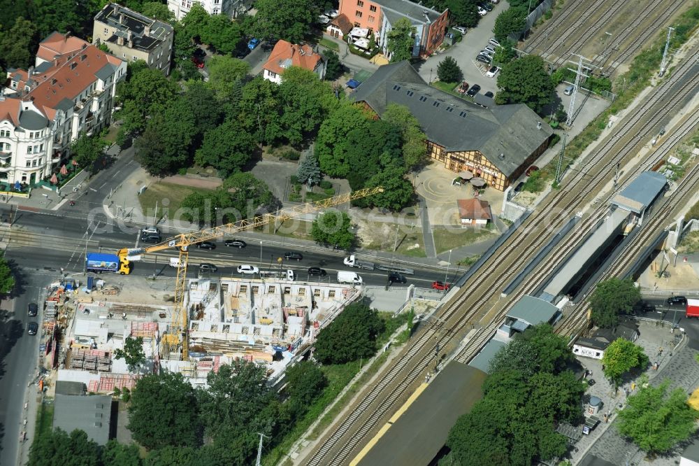 Aerial photograph Berlin - New construction comany Mark-A. Krueger Bauunternehmung GmbH of the building complex of the shopping center Treskowallee - Am Carlsgarten on city- train station Karlshorst in Berlin