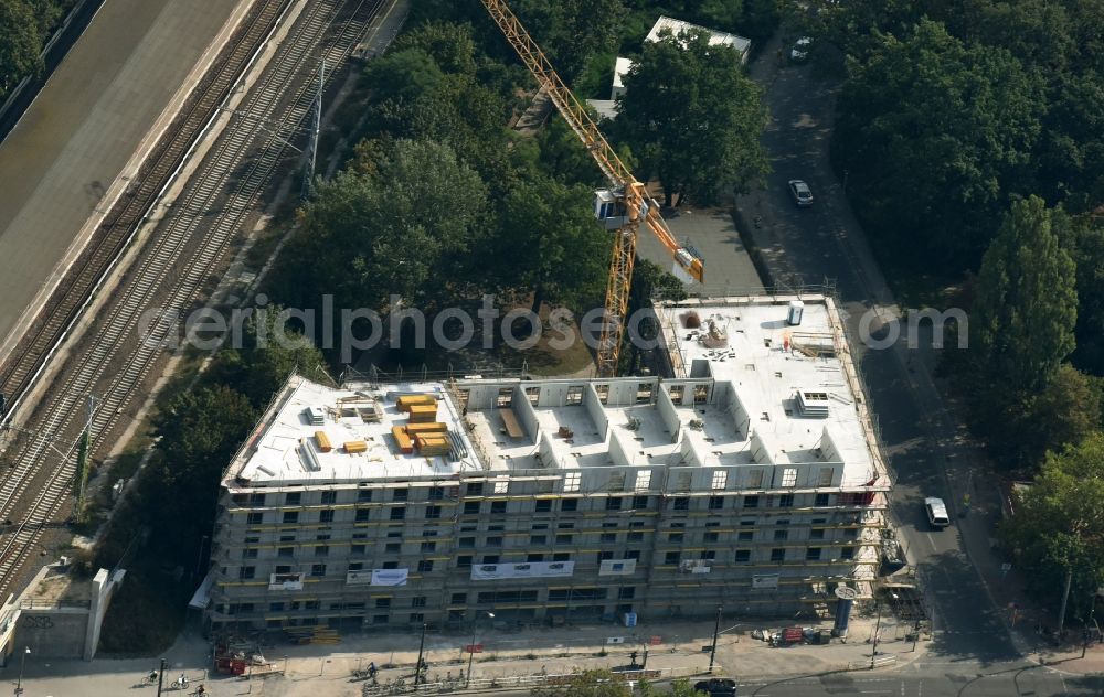 Berlin from above - New construction comany Mark-A. Krueger Bauunternehmung GmbH of the building complex of the shopping center Treskowallee - Am Carlsgarten on city- train station Karlshorst in Berlin