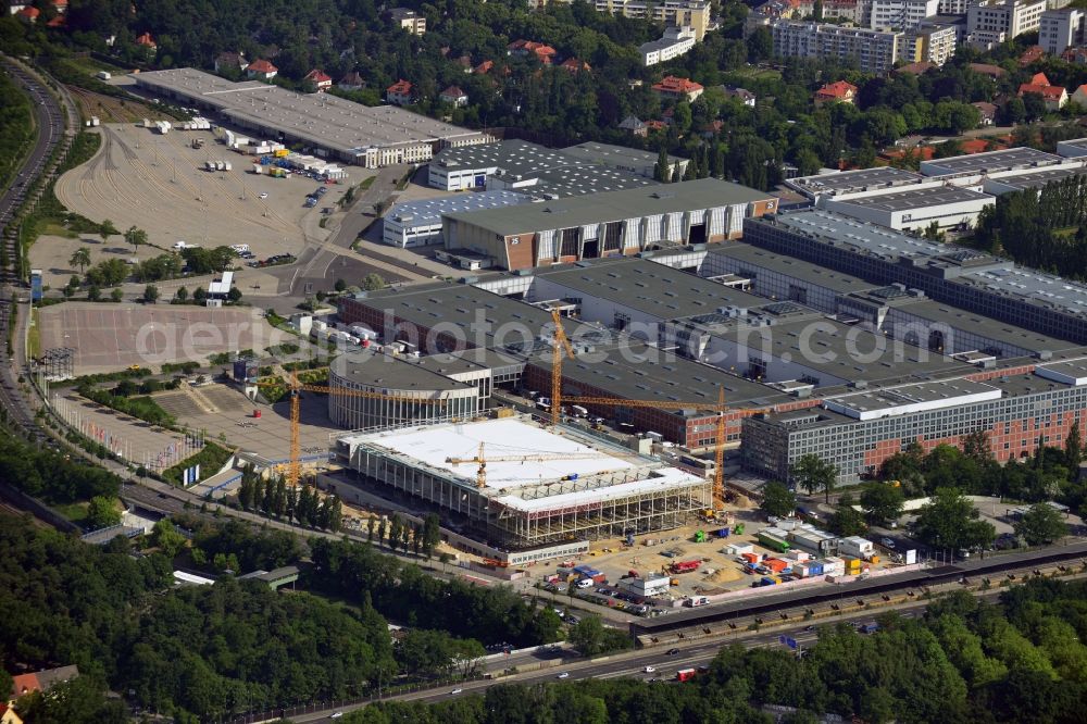 Berlin from the bird's eye view: View of construction site at the exhibition venue Cube City Exhibition Grounds in Berlin Charlottenburg. On the site of the demolished Germany Hall is to be completed by the end of 2013, designed by the architectural firm UNIQUE CODE suitable congress hall