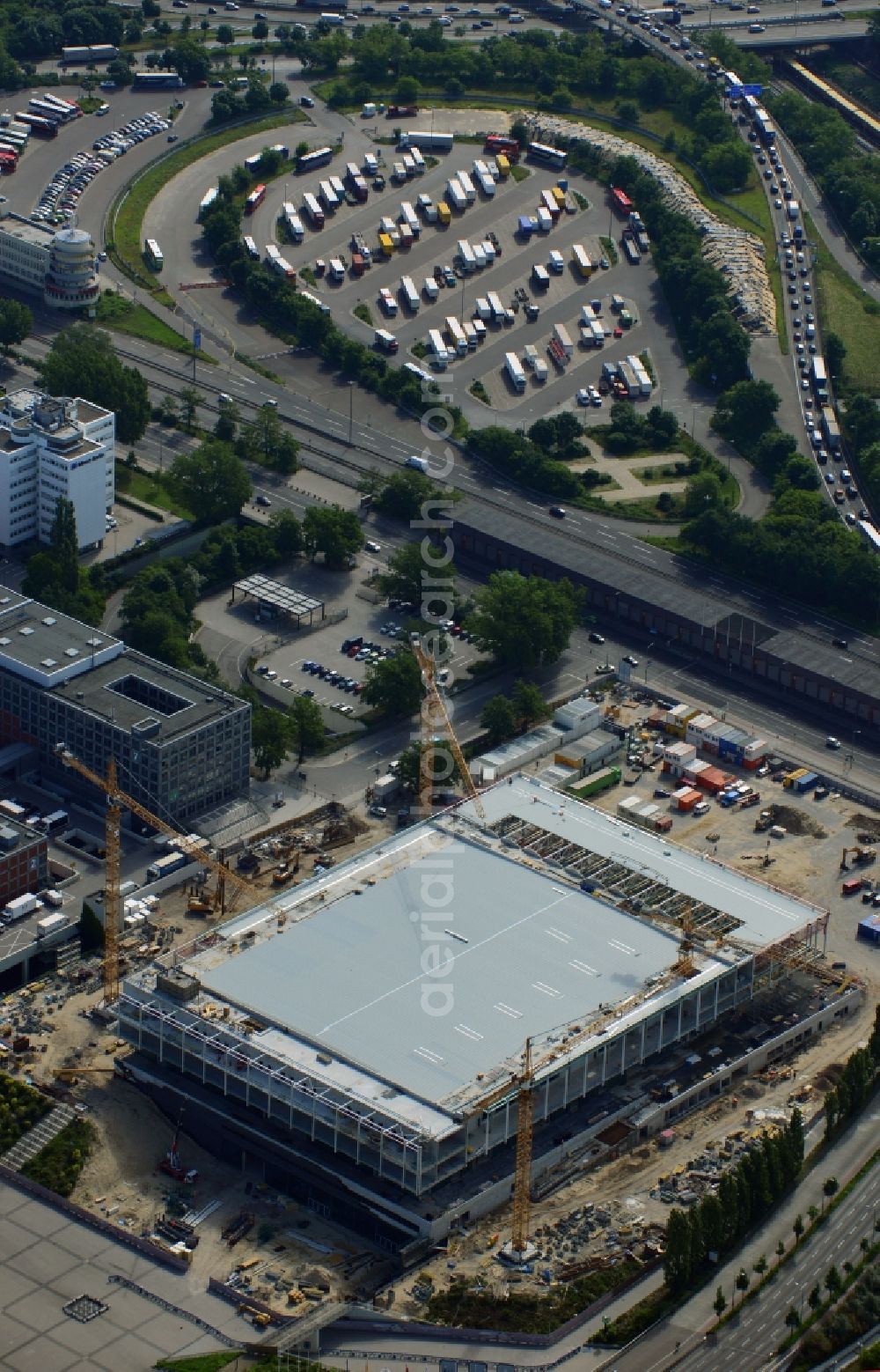 Berlin from the bird's eye view: View of construction site at the exhibition venue Cube City Exhibition Grounds in Berlin Charlottenburg. On the site of the demolished Germany Hall is to be completed by the end of 2013, designed by the architectural firm UNIQUE CODE suitable congress hall