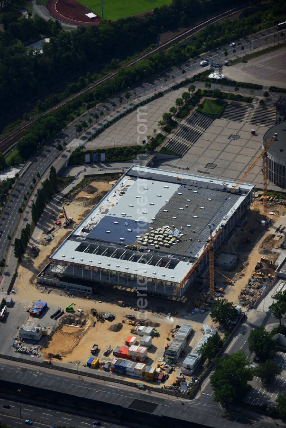 Berlin from the bird's eye view: View of construction site at the exhibition venue Cube City Exhibition Grounds in Berlin Charlottenburg. On the site of the demolished Germany Hall is to be completed by the end of 2013, designed by the architectural firm UNIQUE CODE suitable congress hall