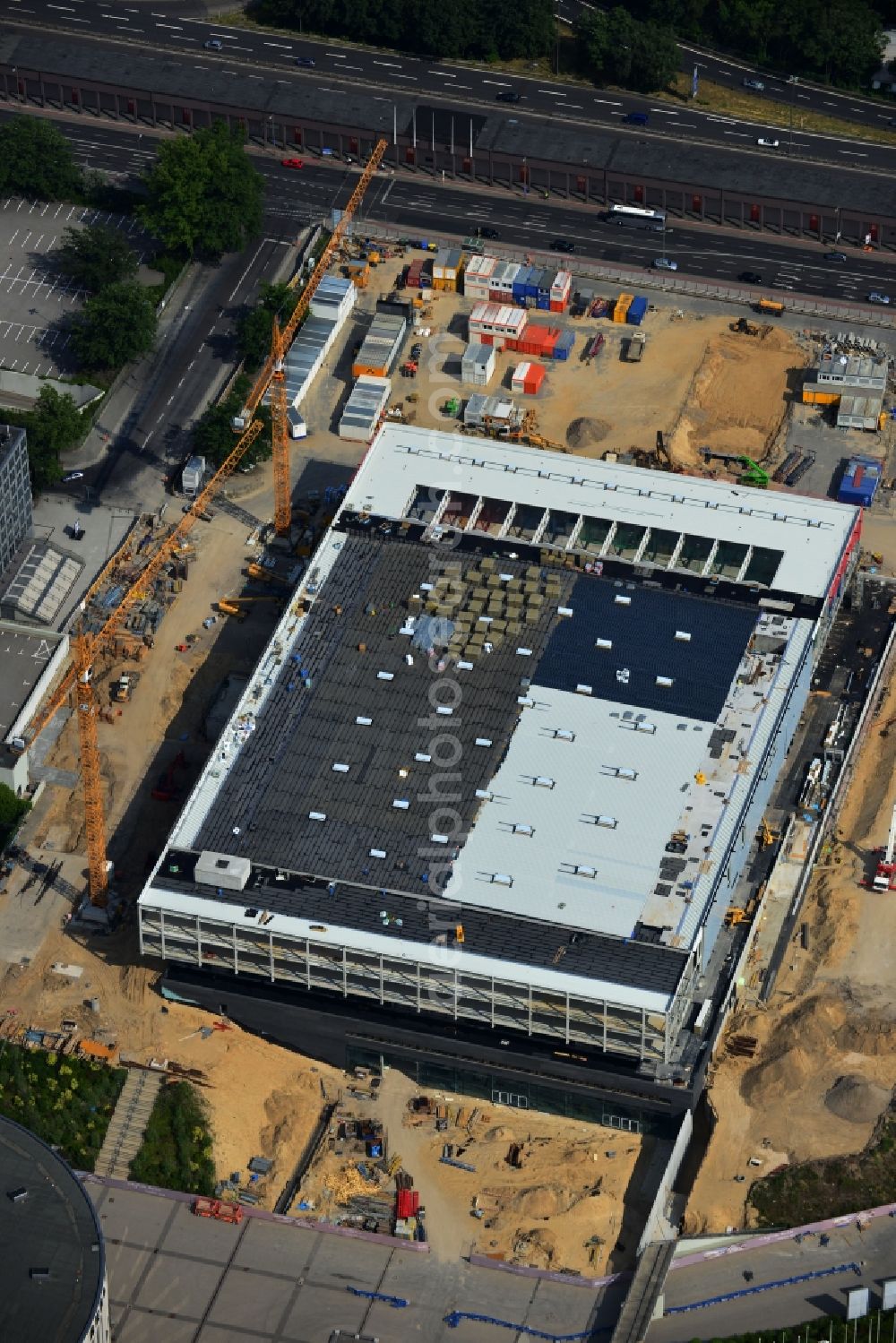 Aerial image Berlin - View of construction site at the exhibition venue Cube City Exhibition Grounds in Berlin Charlottenburg. On the site of the demolished Germany Hall is to be completed by the end of 2013, designed by the architectural firm UNIQUE CODE suitable congress hall