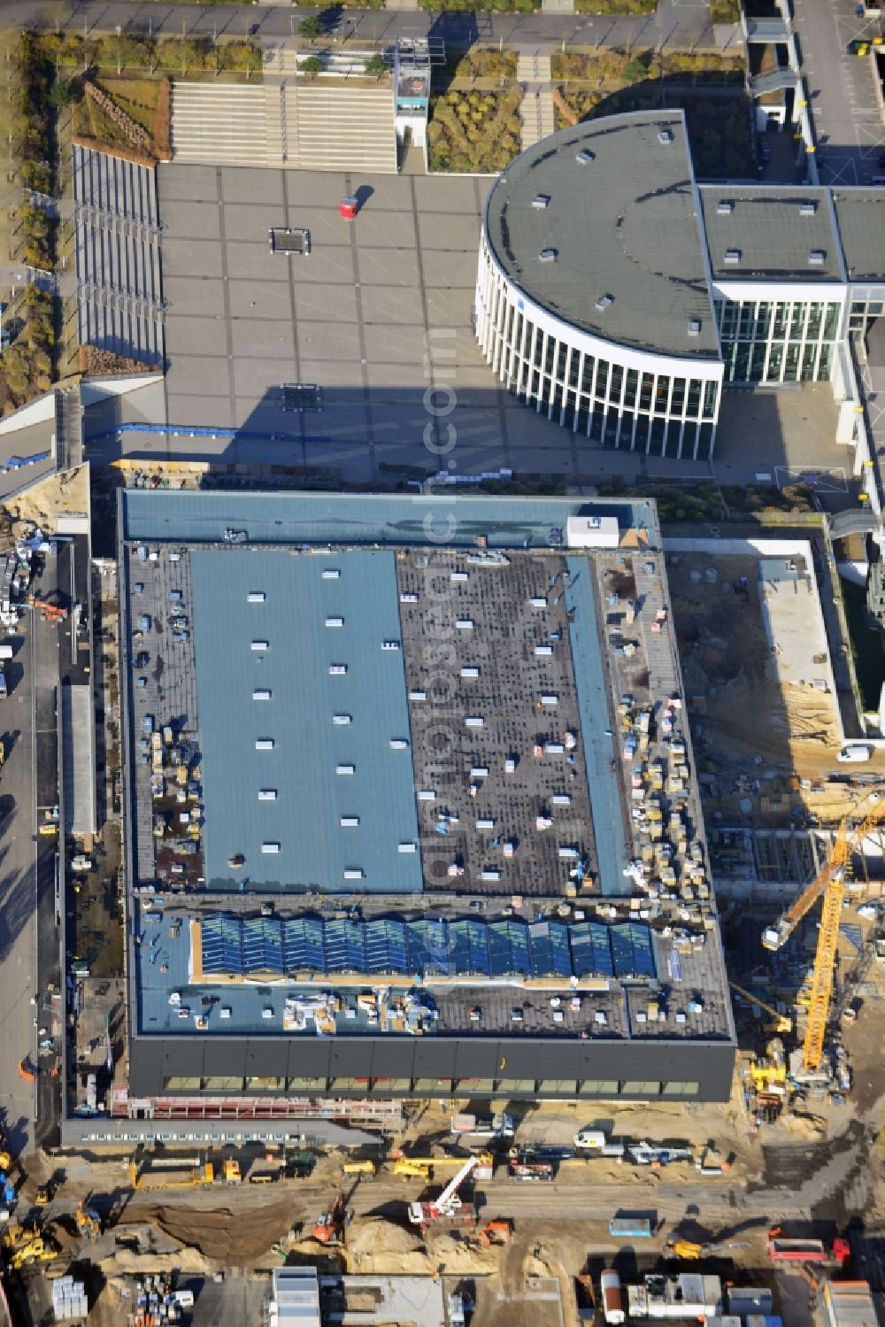 Berlin from the bird's eye view: View of construction site at the exhibition venue Cube City Exhibition Grounds in Berlin Charlottenburg. On the site of the demolished Germany Hall is to be completed by the end of 2013, designed by the architectural firm UNIQUE CODE suitable congress hall