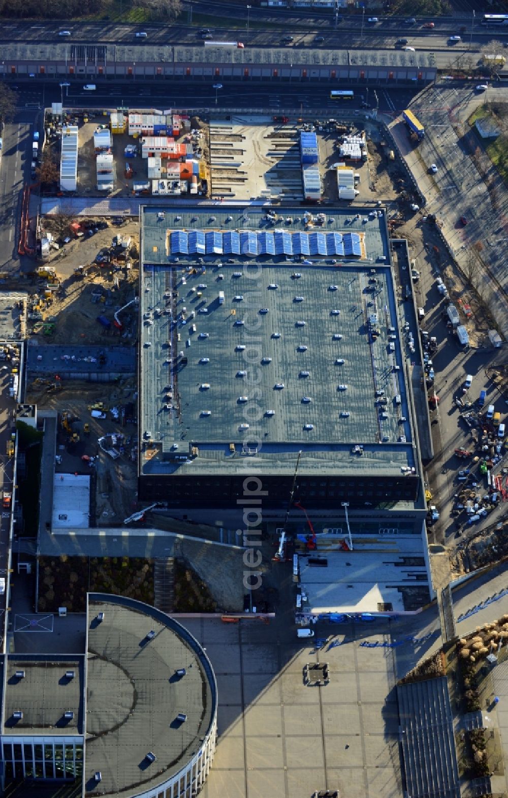 Berlin from the bird's eye view: View of construction site at the exhibition venue Cube City Exhibition Grounds in Berlin Charlottenburg. On the site of the demolished Germany Hall is to be completed by the end of 2013, designed by the architectural firm UNIQUE CODE suitable congress hall