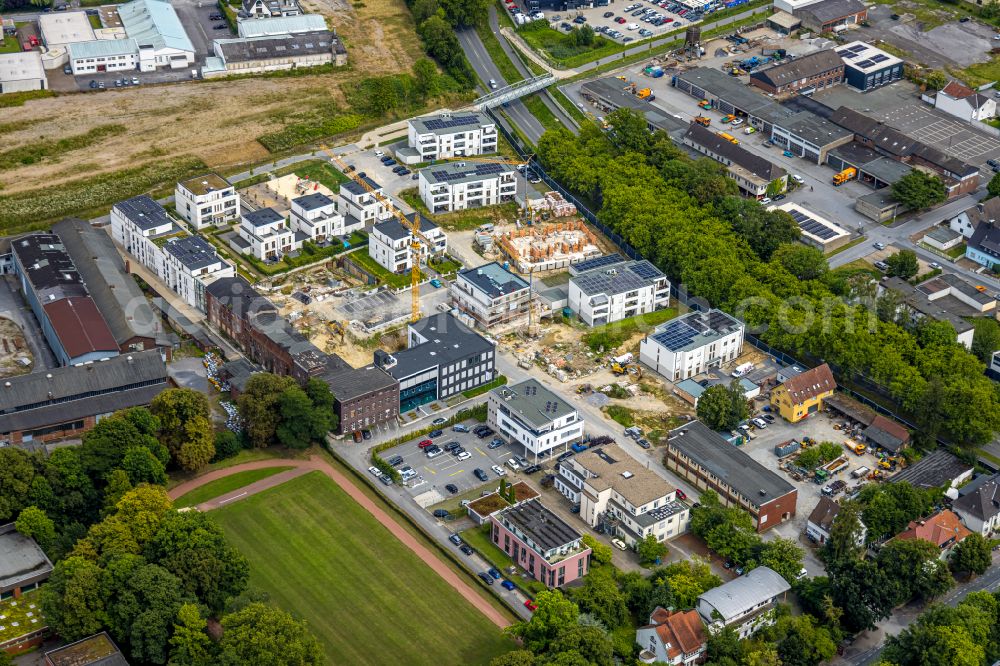 Soest from above - Residential area construction site of a mixed development with multi-family houses and single-family houses- New building at the Merkurhoefe in Soest in the state North Rhine-Westphalia, Germany