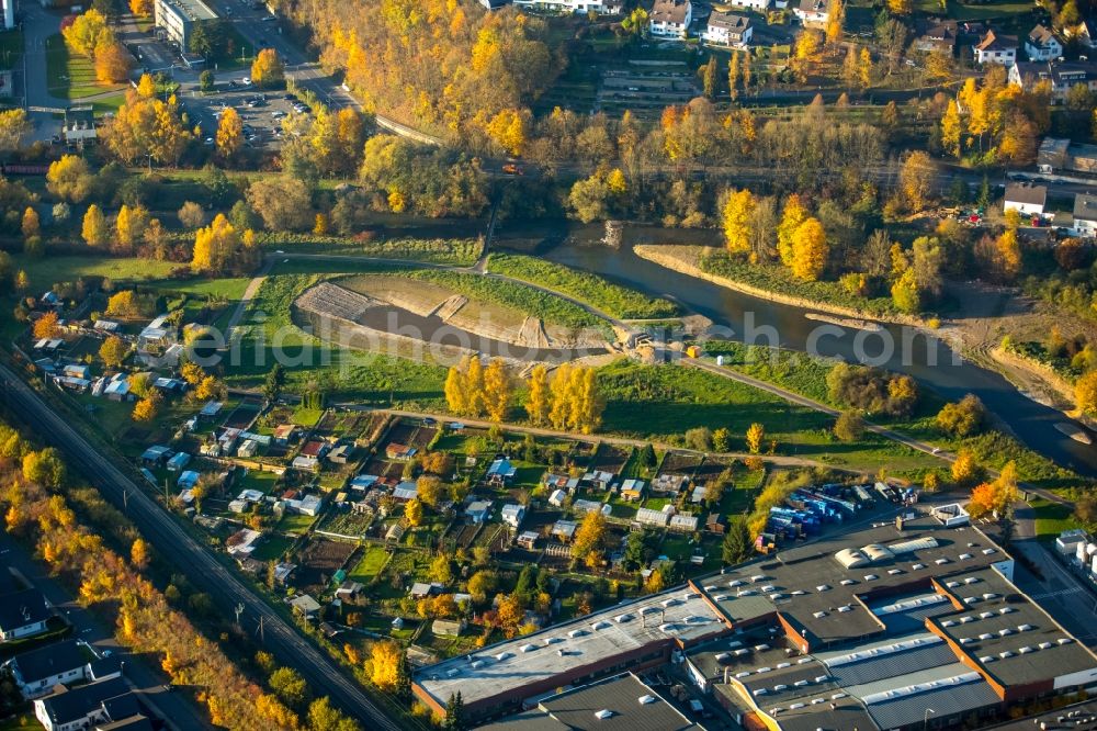 Bamenohl from the bird's eye view: Construction site for the redesign of the course of the river Lenne in the autumnal Bamenohl in the state of North Rhine-Westphalia. The river is being redesigned and will get a small lake on its riverbank, small islands and bicycle lanes