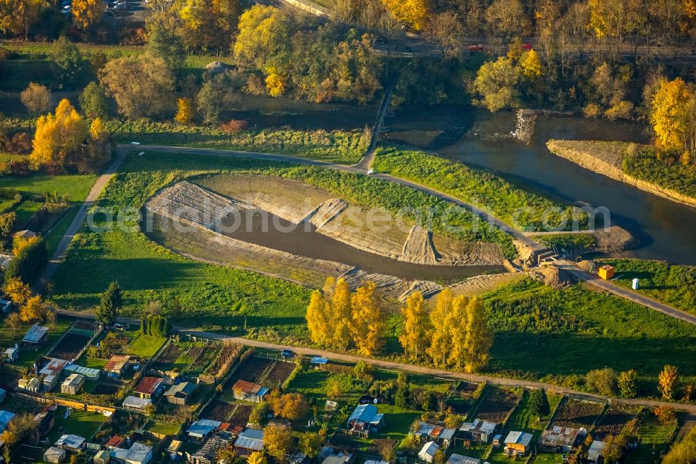 Aerial image Bamenohl - Construction site for the redesign of the course of the river Lenne in the autumnal Bamenohl in the state of North Rhine-Westphalia. The river is being redesigned and will get a small lake on its riverbank, small islands and bicycle lanes