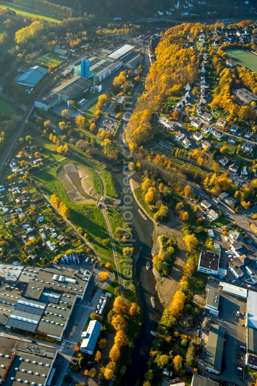 Bamenohl from above - Construction site for the redesign of the course of the river Lenne in the autumnal Bamenohl in the state of North Rhine-Westphalia. The river is being redesigned and will get a small lake on its riverbank, small islands and bicycle lanes