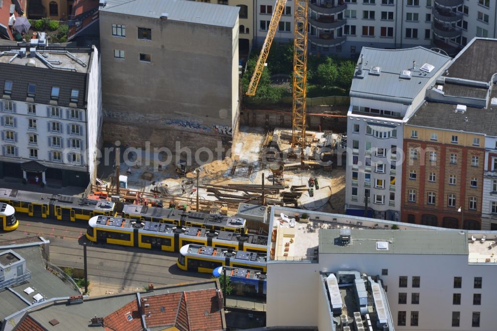 Berlin from above - Building lot between the Hakescher Markt Hotel and a residential building in the Grosse Praesidentenstrasse in Berlin-Mitte overlooking the trams. It is worked on the building foundation and there is built a hotel and a residential building with underground parking. Client is the S&R Beteiligungsgesellschaft GmbH & Co am Hauptbahnhof KG