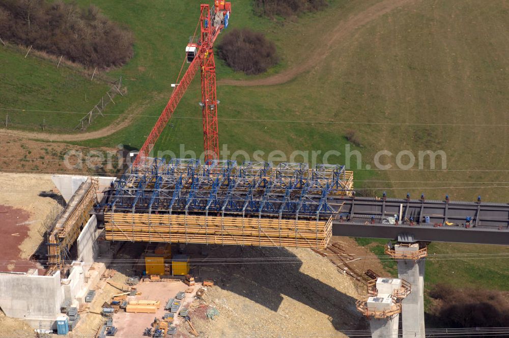 Aerial photograph Ettenhausen - Blick auf die Baustelle der neuen Nessetalbrücke mit einer Länge von 380 m. Die Brücke ist Teil des Projekt Nordverlegung / Umfahrung Hörselberge der Autobahn E40 / A4 in Thüringen bei Eisenach. Durchgeführt werden die im Zuge dieses Projektes notwendigen Arbeiten unter an derem von den Mitarbeitern der Niederlassung Weimar der EUROVIA Verkehrsbau Union sowie der Niederlassungen Abbruch und Erdbau, Betonstraßenbau, Ingenieurbau und TECO Schallschutz der EUROVIA Beton sowie der DEGE??