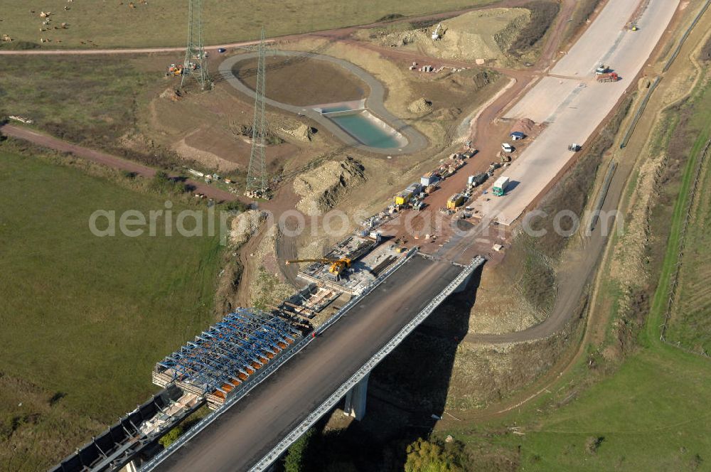 Ettenhausen from the bird's eye view: Blick auf die Baustelle der neuen Nesseltabrücke mit einer Länge von 380 m und einem Regenrückhaltebecken nördlich der Brücke. Die Brücke ist Teil des Projekt Nordverlegung / Umfahrung Hörselberge der Autobahn E40 / A4 in Thüringen bei Eisenach. Durchgeführt werden die im Zuge dieses Projektes notwendigen Arbeiten unter an derem von den Mitarbeitern der Niederlassung Weimar der EUROVIA Verkehrsbau Union sowie der Niederlassungen Abbruch und Erdbau, Betonstraßenbau, Ingenieurbau und T???????????????????????????????????????????????????