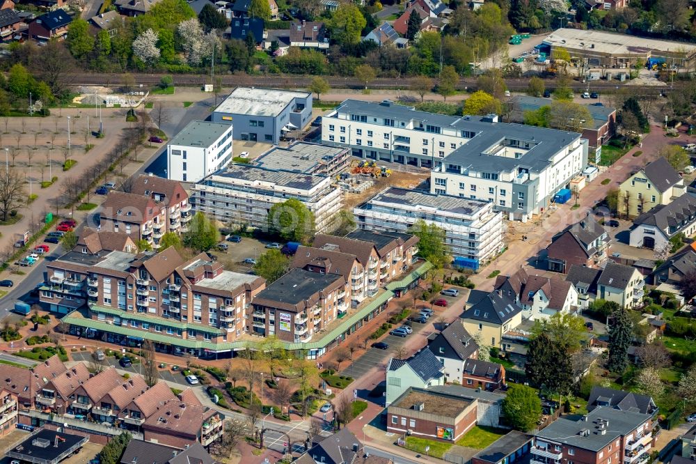 Aerial image Voerde (Niederrhein) - Construction site of the new buildings of the retirement home - retirement carpe diem on Bahnhofstrasse in Voerde (Niederrhein) in the state North Rhine-Westphalia, Germany