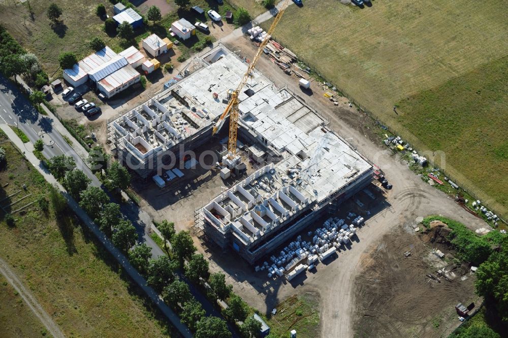 Oranienburg from the bird's eye view: Construction site of the new buildings of the retirement home - retirement of Oranienburger Wohnungsbaugenossenschaft on Walther-Bothe-Strasse in Oranienburg in the state Brandenburg, Germany