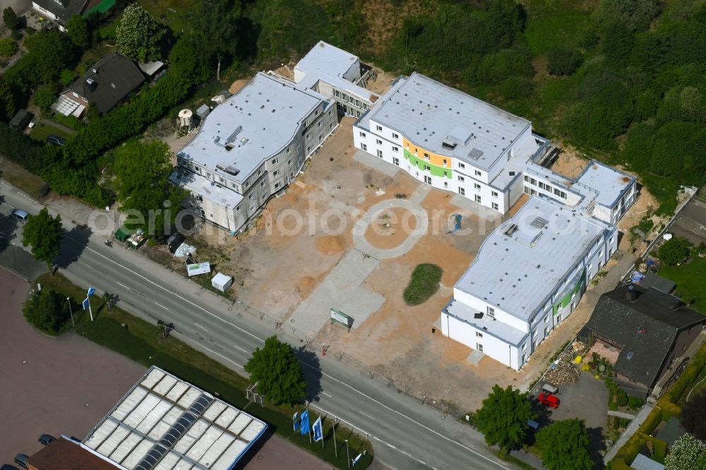 Bark from the bird's eye view: Construction site of the new buildings of the retirement home - retirement Seniorenlandhaus on Segeberger Forst on Bockhorner Landstrasse in Bark in the state Schleswig-Holstein, Germany