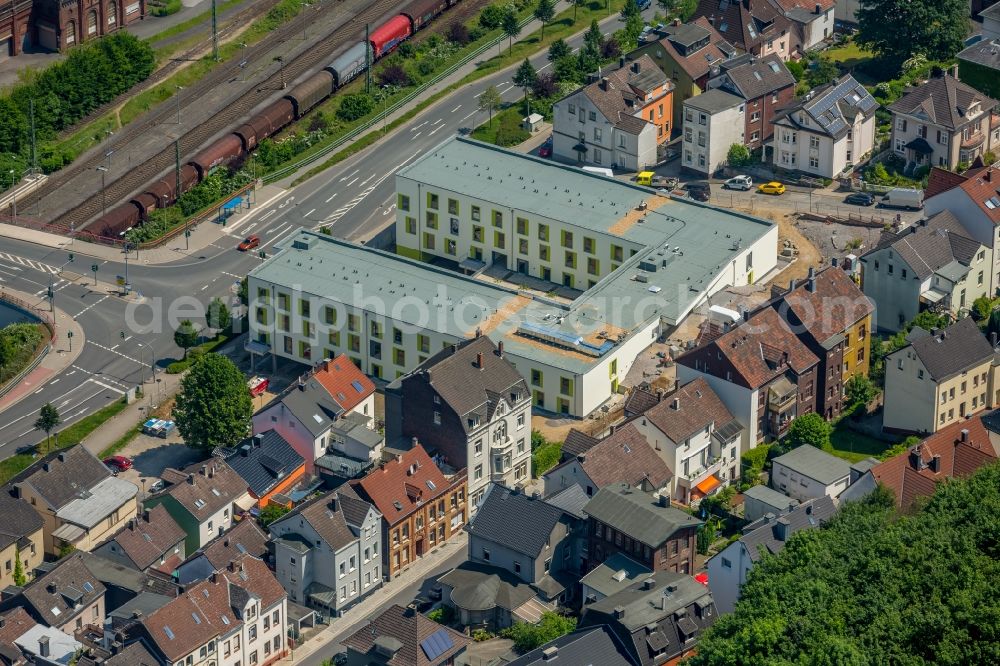 Aerial photograph Hohenlimburg - Construction site of the new buildings of the retirement home - retirement a??Wohlbehagen unter dem Schlossberga?? of FFB-Projektentwicklung GmbH und Beteiligung der Ambrock GmbH in Hohenlimburg in the state North Rhine-Westphalia