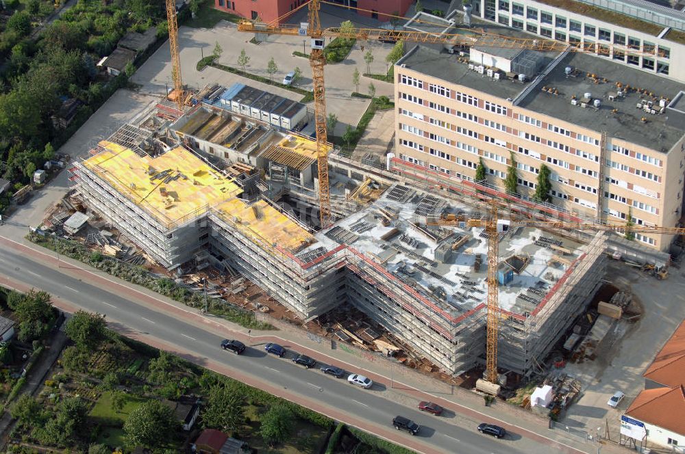 Aerial image Magdeburg - Blick auf die Baustelle vom Neubau am Leibniz-Institut für Neurobiologie im Stadtteil Alte-Neustadt. Nach der Fertigstellung des Neubaus erfolgt der Abriss des Bestandsgebäudes. Kontakt: Leibniz-Institut für Neurobiologie (IfN) Stiftung des Öffentlichen Rechts, Brenneckestraße 6, 39118 Magdeburg, Tel. +49(0)391 6263219, Fax +49(0)391 616160, email: WO@ifn-magdeburg.de; Planungsgemainschaft: pbr Planungsbüro Rohling AG und Assmann Beraten + Planen GmbH, Ansprechpartner: Herr Jörg Rasehorn, rasehorn.joerg@pbr.de