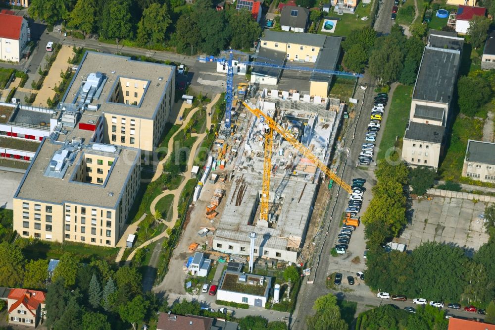 Berlin from above - Construction site of a new build retirement home of Vivantes Forum fuer Senioren GmbH on Muensterberger Weg in the district Kaulsdorf in Berlin, Germany