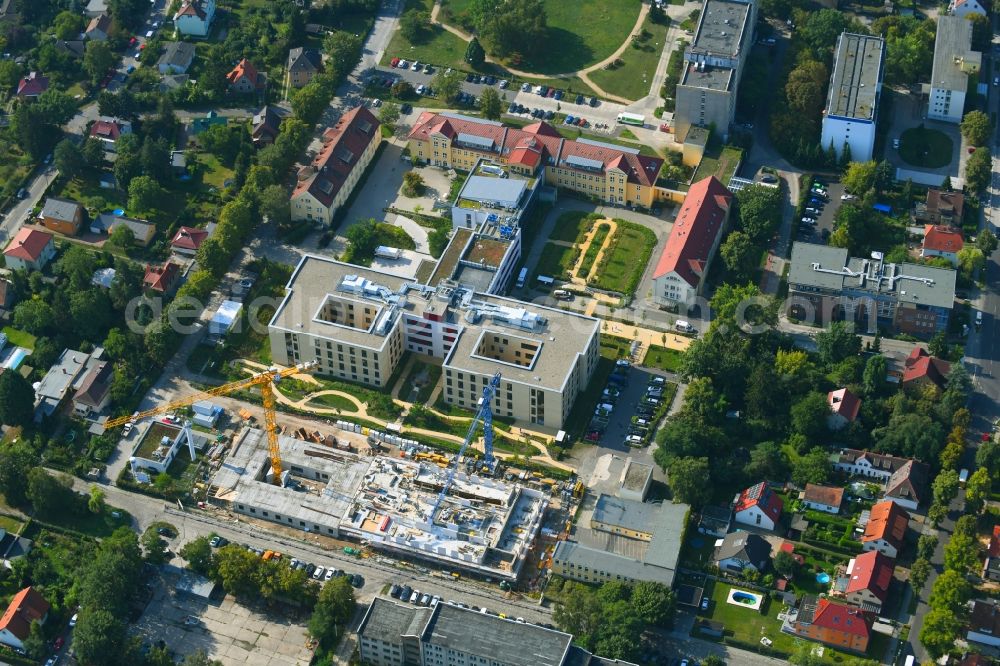 Berlin from above - Construction site of a new build retirement home of Vivantes Forum fuer Senioren GmbH on Muensterberger Weg in the district Kaulsdorf in Berlin, Germany