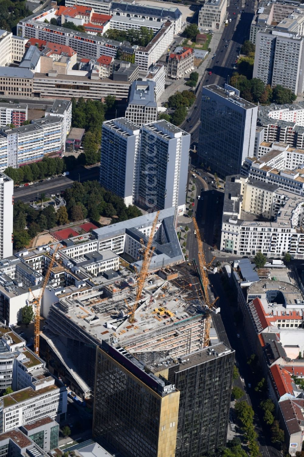 Berlin from above - Construction site with pile foundation work for the foundation plate of the new building Axel Springer Campus - OMA to Krausenstrasse - Schuetzenstrasse in Berlin