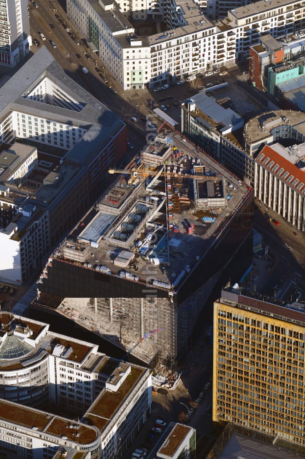 Berlin from the bird's eye view: Construction site with pile foundation work for the foundation plate of the new building Axel Springer Campus - OMA to Krausenstrasse - Schuetzenstrasse in Berlin