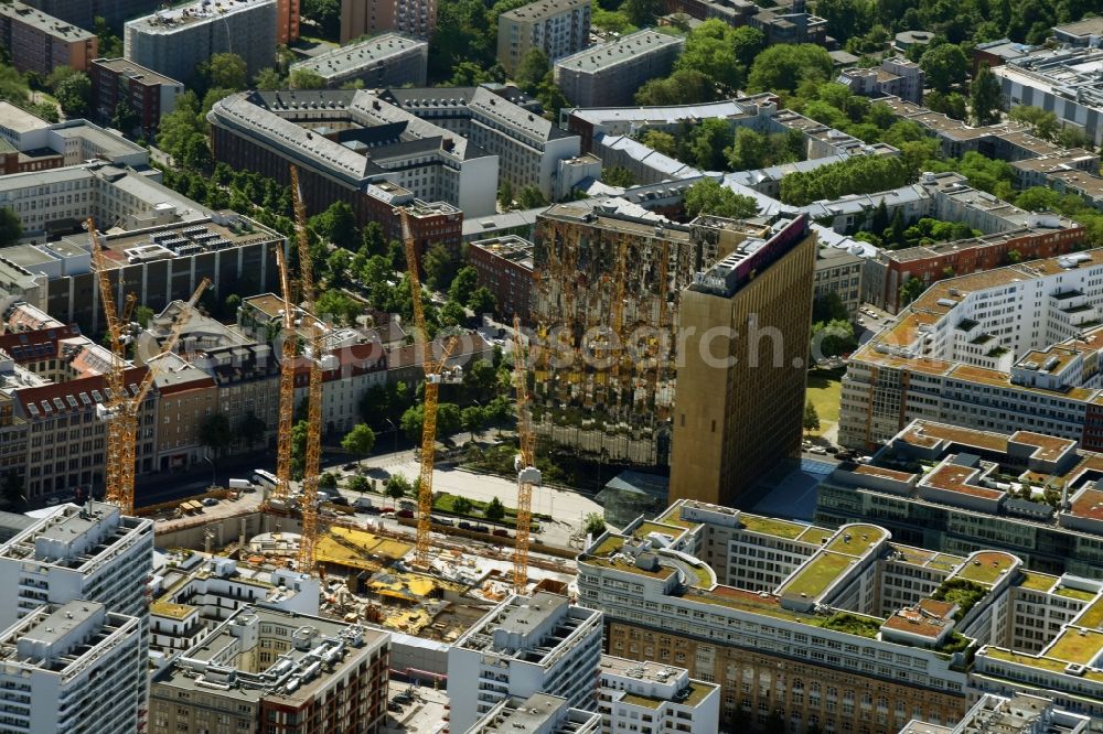 Aerial image Berlin - Construction site with pile foundation work for the foundation plate of the new building Axel Springer Campus - OMA to Krausenstrasse - Schuetzenstrasse in Berlin