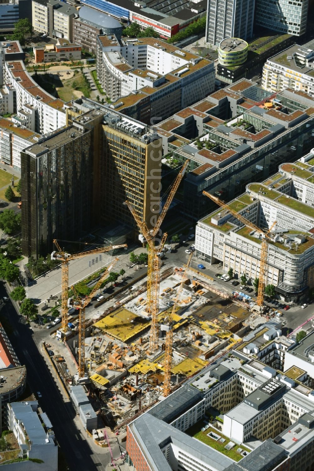 Berlin from above - Construction site with pile foundation work for the foundation plate of the new building Axel Springer Campus - OMA to Krausenstrasse - Schuetzenstrasse in Berlin