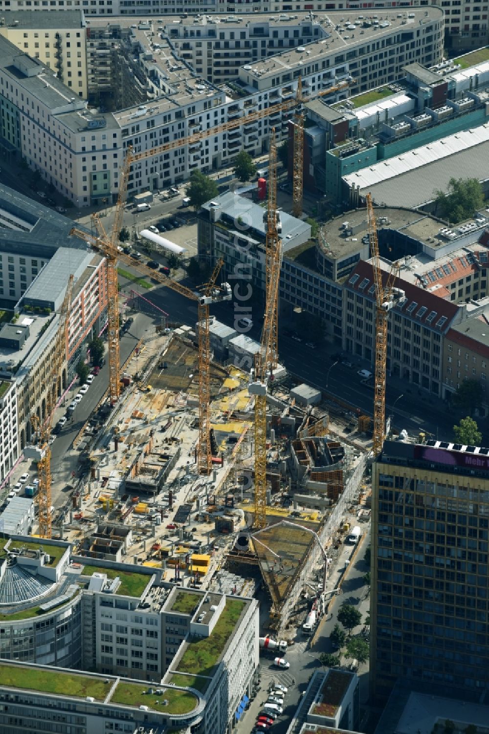 Aerial image Berlin - Construction site with pile foundation work for the foundation plate of the new building Axel Springer Campus - OMA to Krausenstrasse - Schuetzenstrasse in Berlin