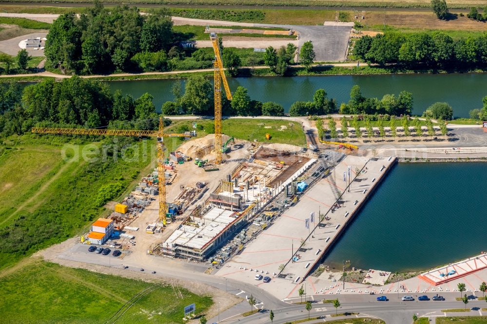 Gelsenkirchen from the bird's eye view: Construction site of a new building der Stoelting Service Group GmbH an der Johannes-Rau-Allee in the district Bismarck in Gelsenkirchen in the state North Rhine-Westphalia