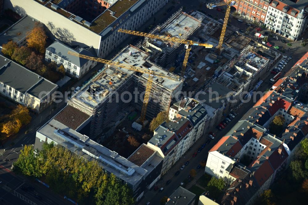 Berlin from above - View the construction site of the new building of a residential house with condominiums on the Oberbaum City in the district Friedrichshain in Berlin. It is a project of the AccoNarva Engineering Ltd. The bodyshell has been commissioned by the ANES Construction Work Berlin GmbH