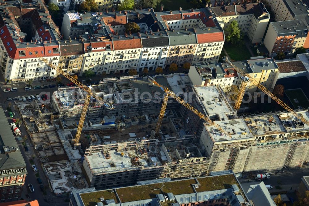 Berlin from above - View the construction site of the new building of a residential house with condominiums on the Oberbaum City in the district Friedrichshain in Berlin. It is a project of the AccoNarva Engineering Ltd. The bodyshell has been commissioned by the ANES Construction Work Berlin GmbH